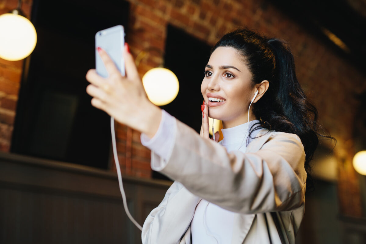 brunette woman in white jacket having dark eyes wi 2023 11 27 05 29 55 utc