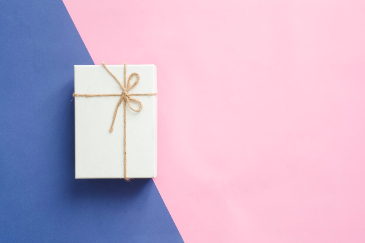 festive box with shiny ribbon bow on pastel pink b 2023 11 27 05 15 55 utc
